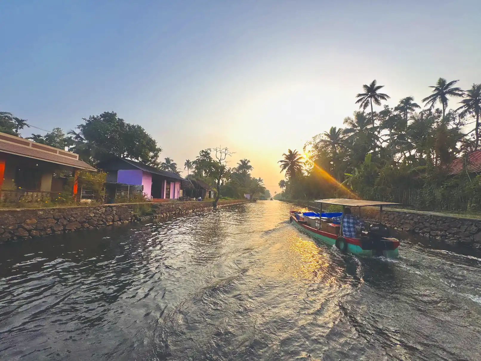 Golden-hour canal route during an Alleppey sunset boat ride