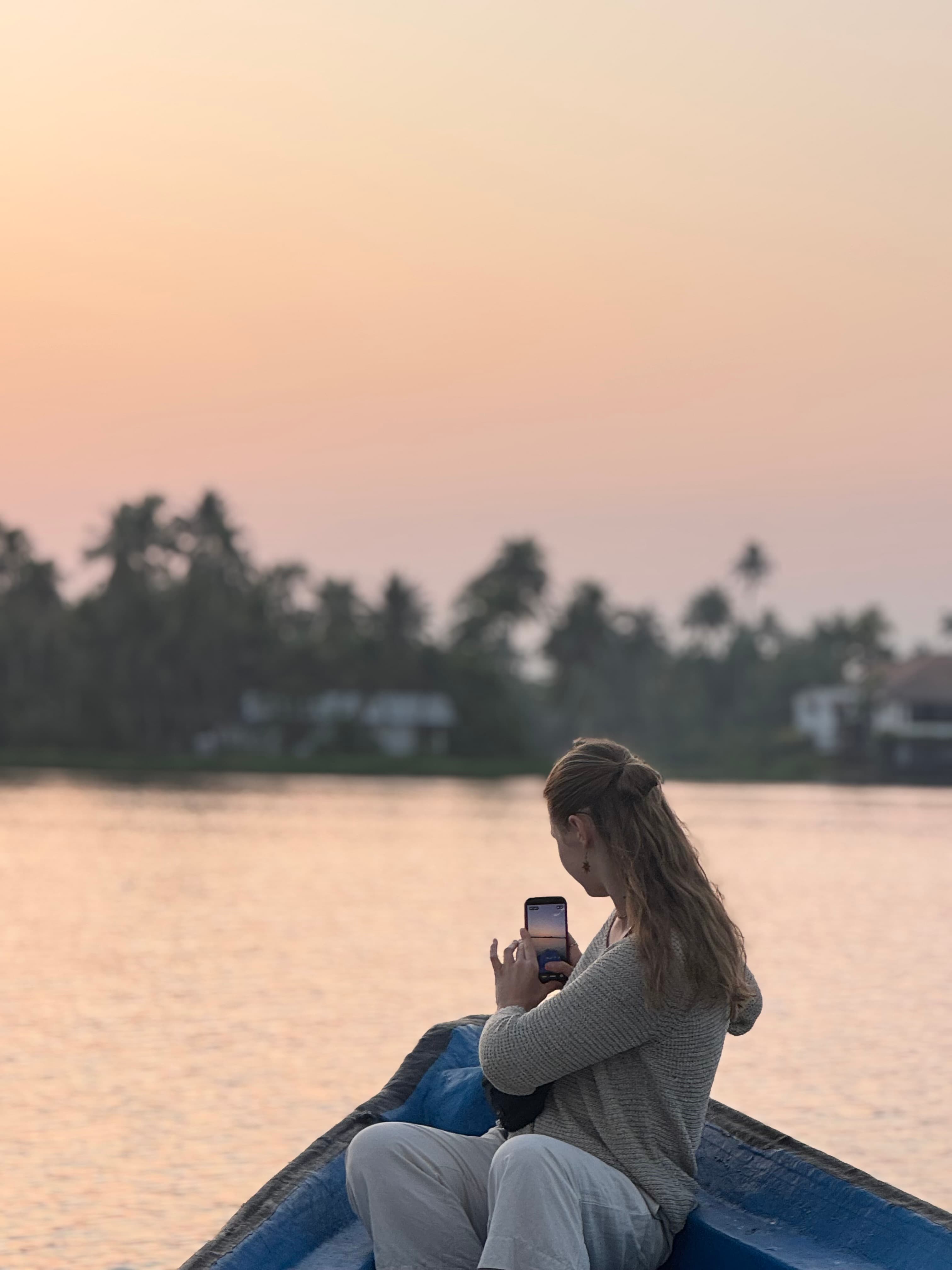 Guest smiling on a private houseboat in the Alleppey backwaters